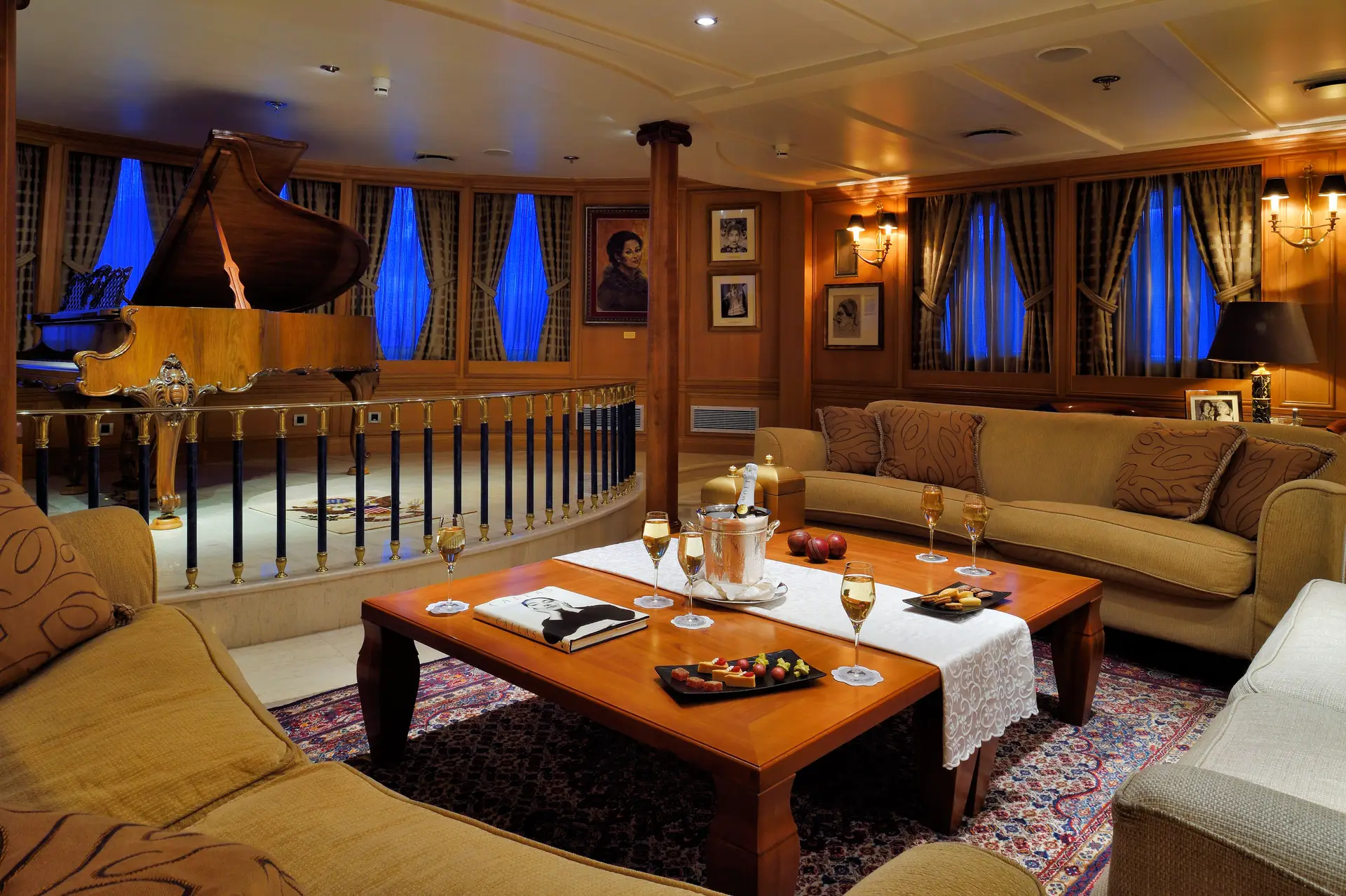 Lounge with a grand piano, seating and panelled walls