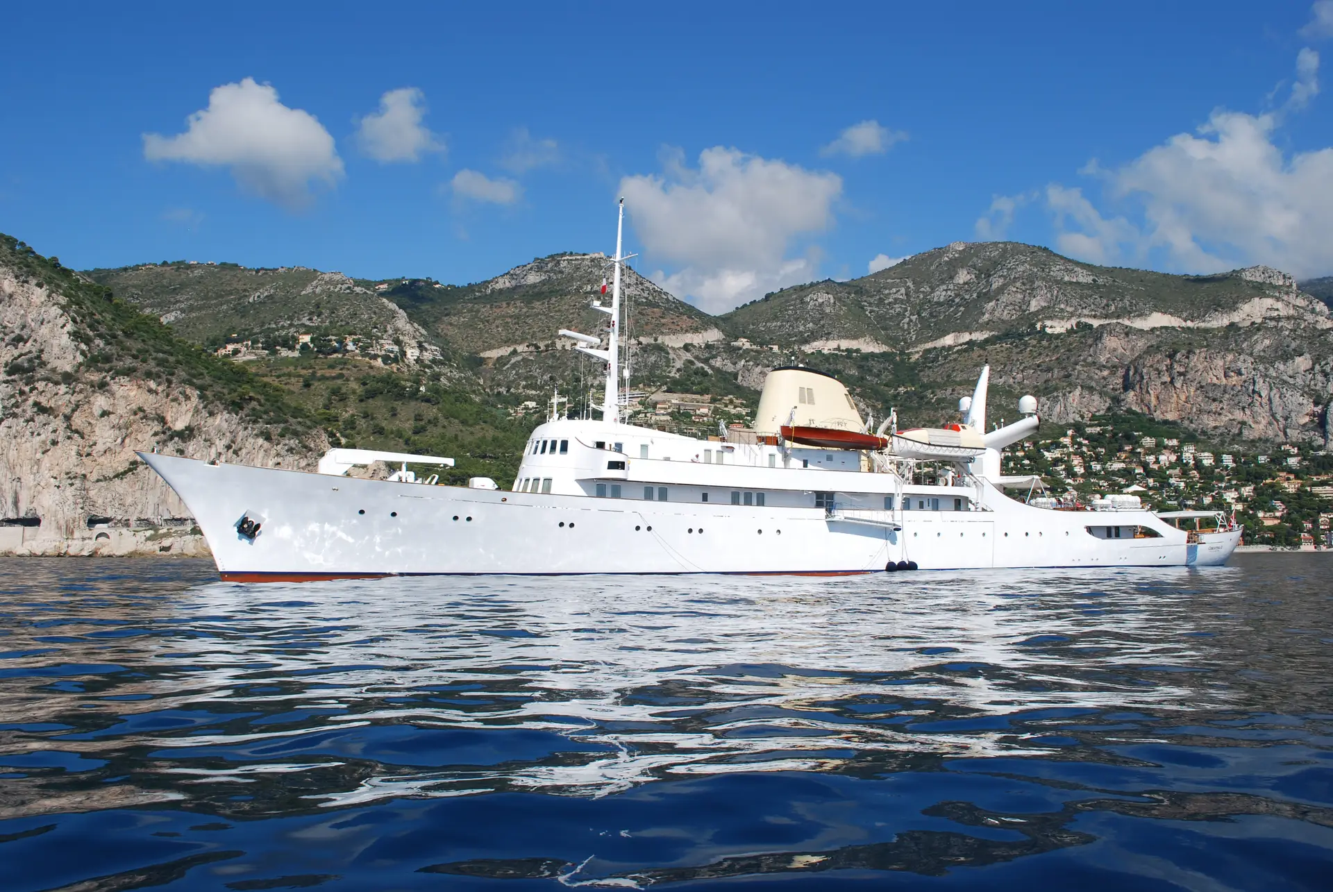 Full broadside profile of Christina O, white hull, long white superstructure and cream funnel