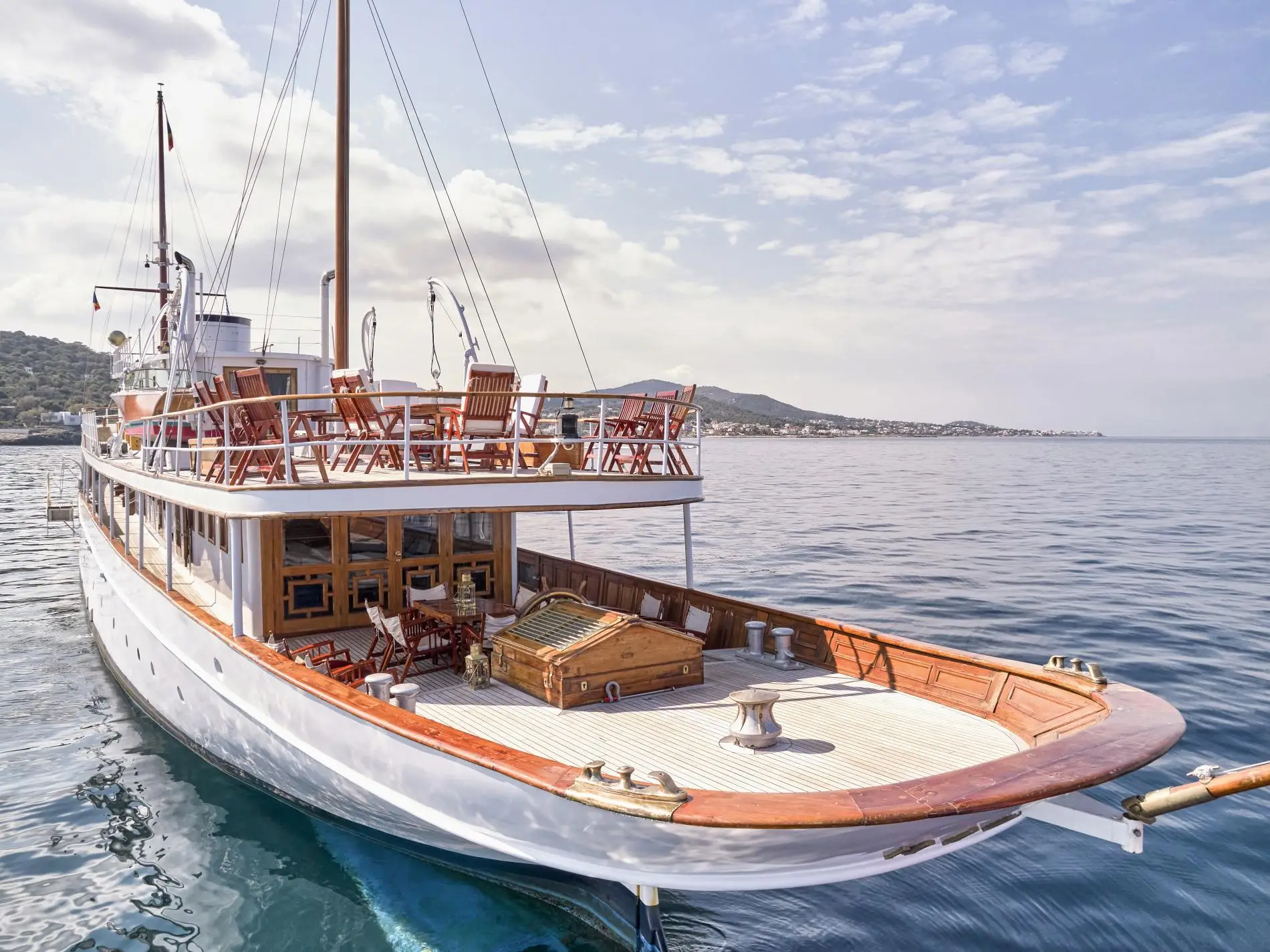 Madiz's aft deck with teak planking, folding deck chairs, panelled bulwarks and a skylight
