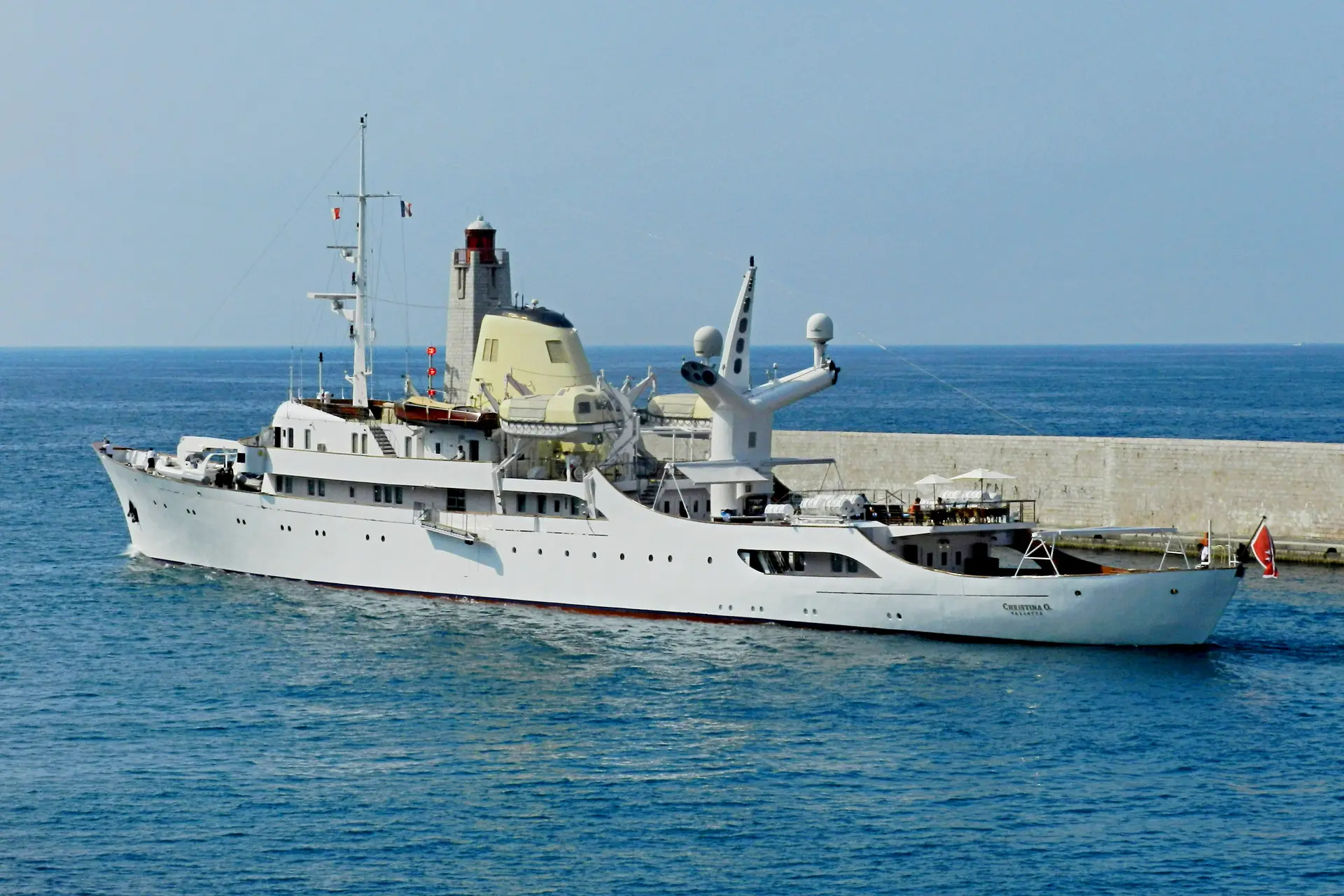 Christina O alongside in a stone-walled harbour reported as Valletta