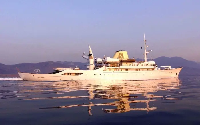 Christina O photographed at anchor in low evening light