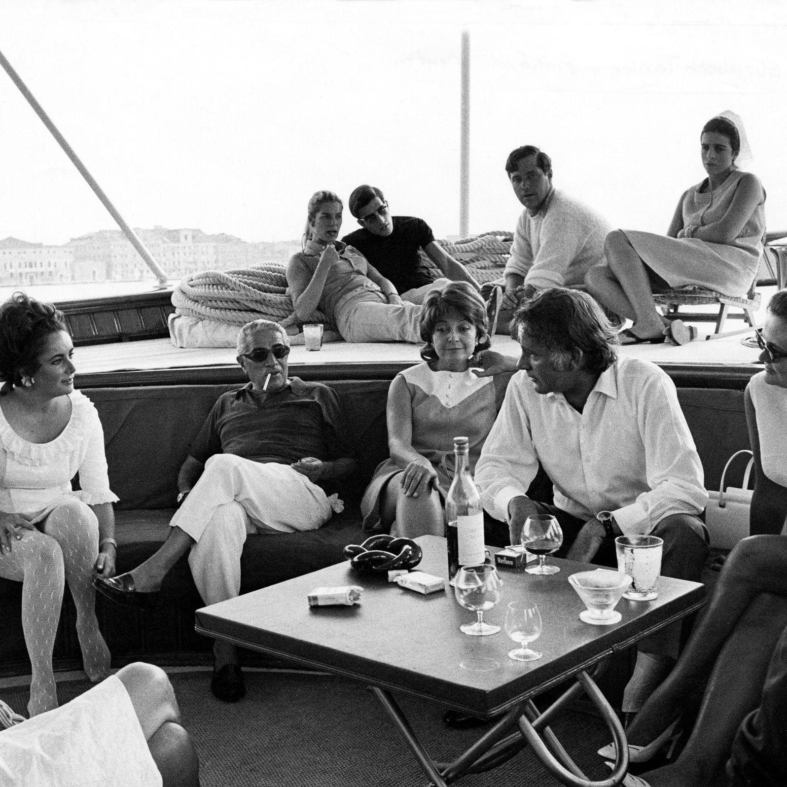 Guests seated on the deck of the yacht Christina in the 1960s