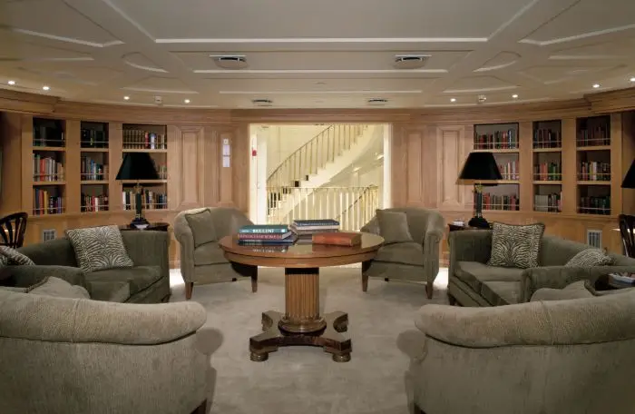 Seating area adjoining the library, with shelving and soft furnishings